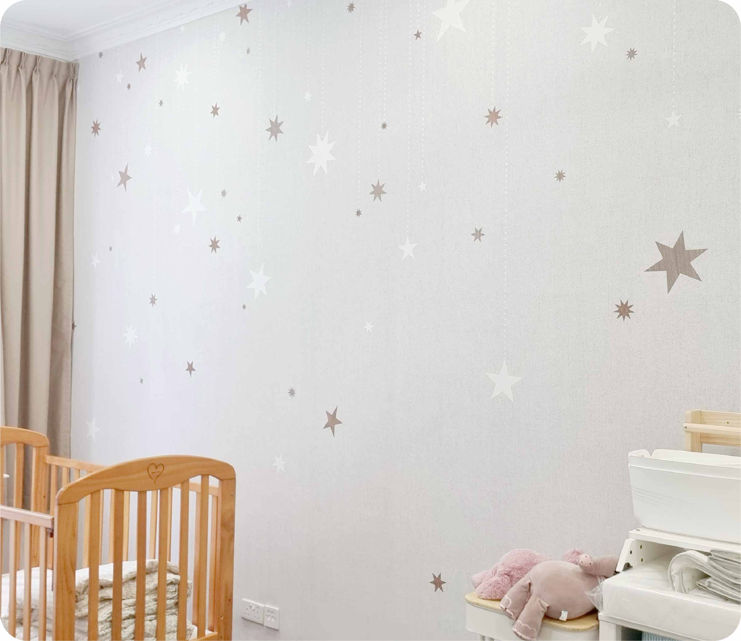a close up of Rebel walls Stargazing Wallpaper wrapped in a kids room